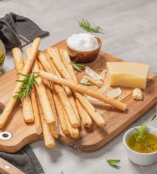 homemade sourdough breadsticks on cutting board